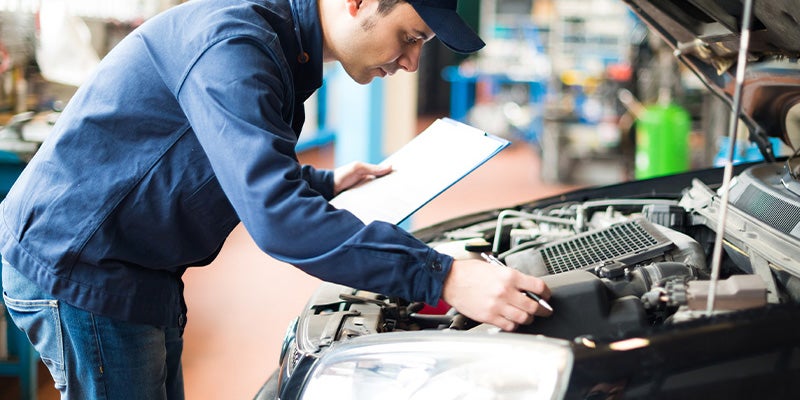 Plattner's Quincy Chevrolet in QUINCY FL technician working on car