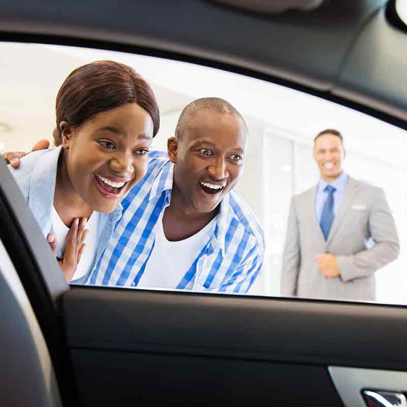 Plattner's Quincy Chevrolet in QUINCY FL customers looking in new car